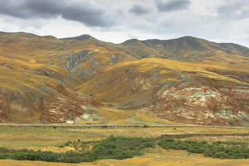 Cross-bedding in Candy Cane Mountains in Azerbaijan. Colorful stripes of the hills. Shale striped mountains. Red-pink and white striped area of exposed rock