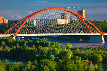 bugrinskiy bridge with red arch in novosibirsk in summer