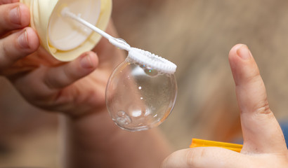 Soap bubble in the hand.