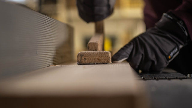 Carpenter Hammering Nail ito Wood with Hammer Woodwoking Close Up