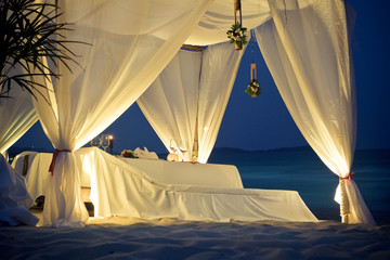 Restaurant tent with table served on the beach