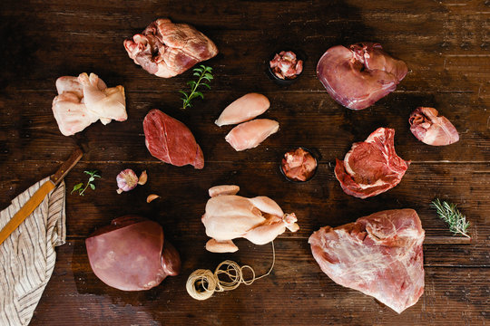 Assortment of uncooked meats.