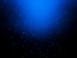 Blue bokeh on a dark background. Blur the background and wallpaper