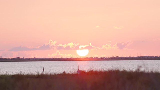 Huge sunset over the bayou in Isle de Jean Charles, Louisiana