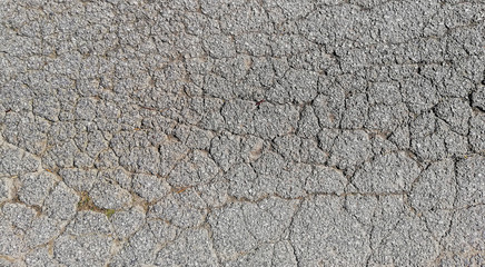 texture of old cracked asphalt surface background
