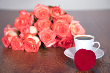 roses and ring on table