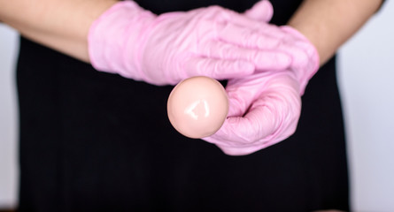 The pastry chef makes dessert on a stick. Cake pops. Chocolate cream for dessert, creation process.