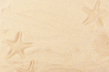 Fototapeta na wymiar Warm summer backdrop with painted sand pictures. Baby drawn starfish background. Empty space for creative design or text. Holidays and travelling concept
