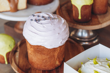 Modern stylish easter pies with toppings, festive composition in rustic style, russian orthodox tradition, vintage wooden background,