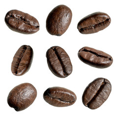 Close up falling coffee beans isolated on white background including clipping path. Collection of various coffee beans.
