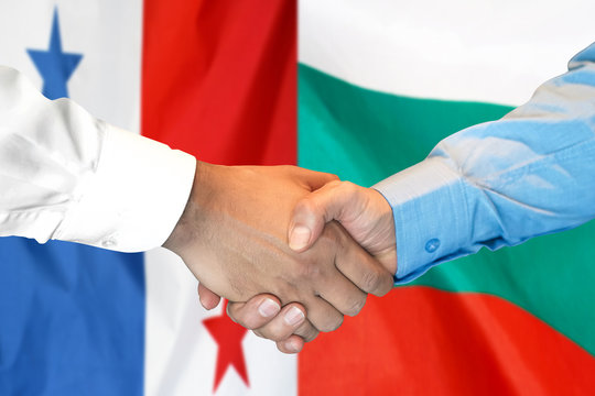 Handshake on Panama and Bulgaria flag background.