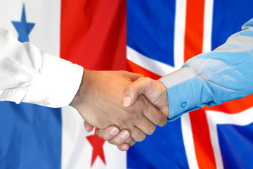 Handshake on Panama and Iceland flag background.