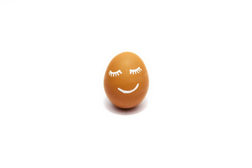 One smiling brown egg isolated on the white background.