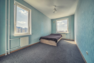 Empty cheap furnished rental room with no decor