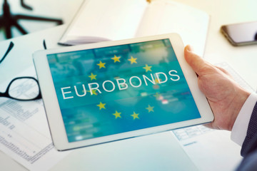 man at a desk and text eurobonds in a tablet