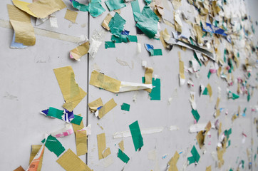 Wall with torn label sticker.