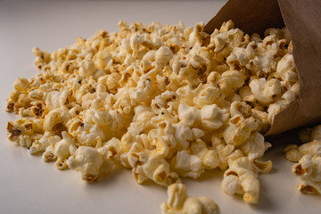 Heap of delicious popcorn on the white background.