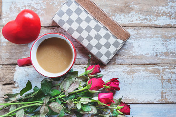 Red coffee cup with heart and rose Valentines Day concept