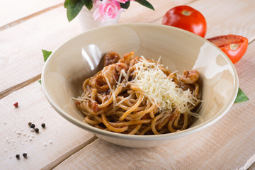 Paste with cheese and tomatoes in the restaurant