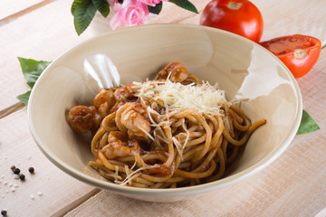 Paste with cheese and tomatoes in the restaurant