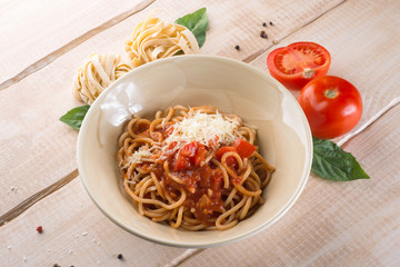 Paste with cheese and tomatoes in the restaurant