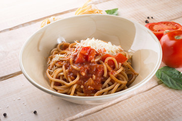 Paste with cheese and tomatoes in the restaurant