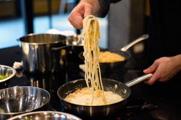 Process of preparation of spaghetti in the restaurant