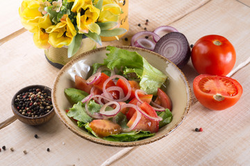 Salad with greens, meat, eggs and tomatoes