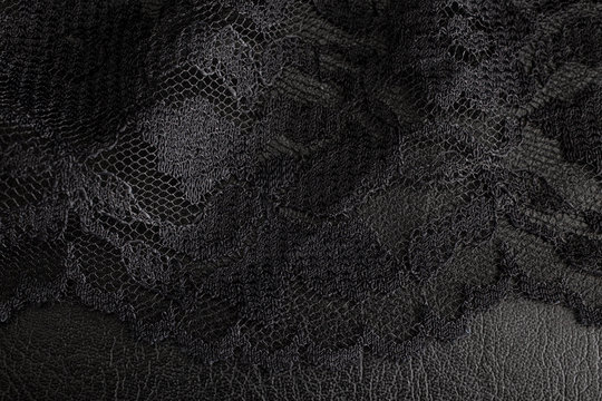 Black lace on black background