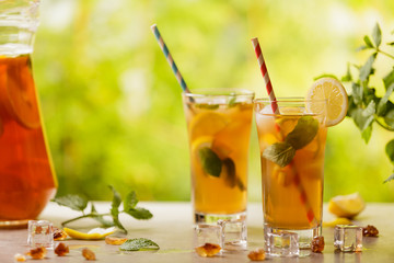 Iced tea with lemon and ice cubes