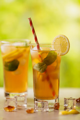 Iced tea with lemon and ice cubes