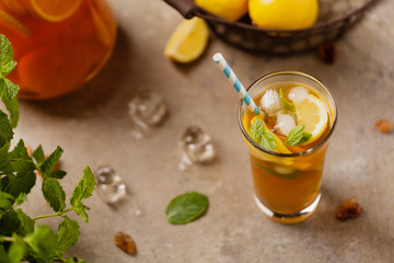 Iced tea with lemon and ice cubes