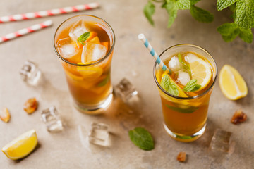 Iced tea with lemon and ice cubes