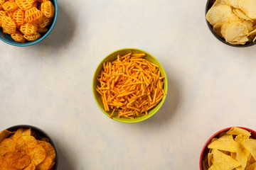 Bowls with snacks like chips, crisps, popcorn. Perfect for a party. Top view.