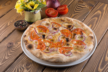 Delicious pizza with cheese, olives and greens