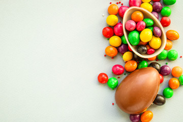 chocolate egg and candy easter decor, menu concept background. top view. copy space for text