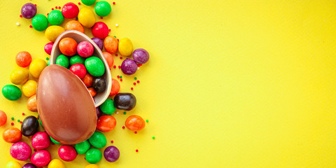 Fototapeta na wymiar chocolate egg and candy easter decor, menu concept background. top view. copy space for text