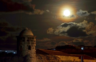 Full moon rising above old Havana fortress