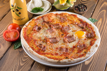 Delicious pizza with cheese, tomatoes and olives