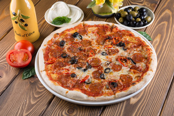 Delicious pizza with cheese, tomatoes and olives