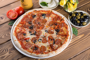 Delicious pizza with cheese, tomatoes and olives