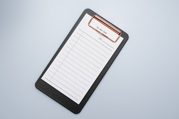 
To-to list notepad on black board clip