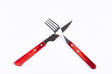 Red fork and knife or white background