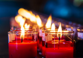 Red candle in glass