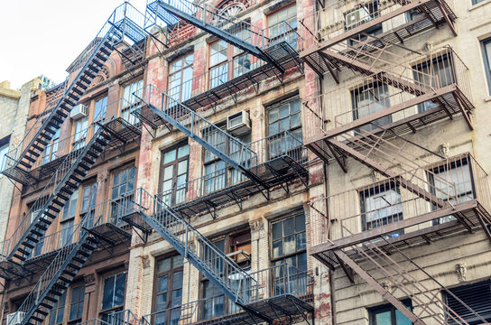 Traditional Apartments with Fire Escape Ladders in New York, USA