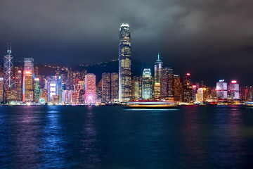 View of Victoria Harbor and Hong Kong at night. Urban landscape.