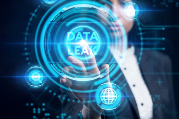 Business, Technology, Internet and network concept. Young businessman working on a virtual screen of the future and sees the inscription: Data leak