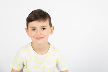 happy little boy on white background