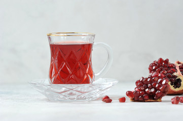 Traditional hibiscus tea made from Sudanese rose petals.  Two cups with a drink on a light background.  Close-up.