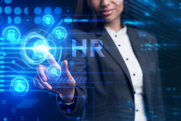 Business, Technology, Internet and network concept. Young businessman working on a virtual screen of the future and sees the inscription: HR